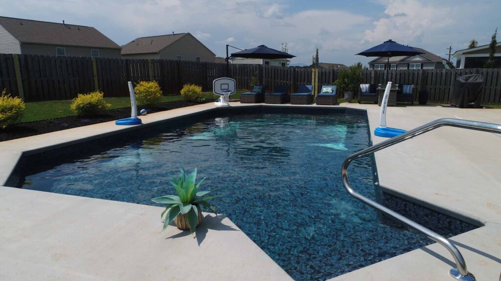 An inground vinyl pool with an asymmetrical design