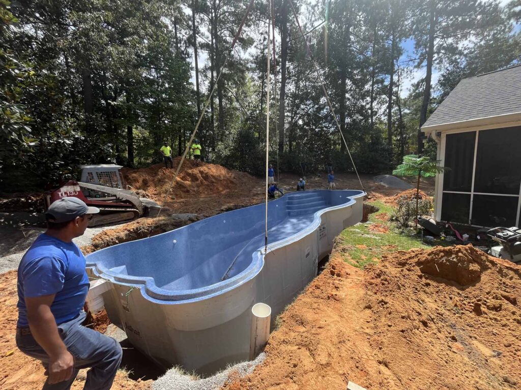 Our team installing a fiberglass pool shell