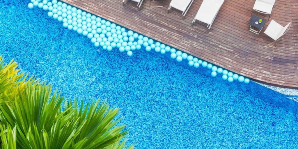 Modern fiberglass swimming pool showcasing a variety of pool color finishes in a backyard | Fiberglass Pool Colors